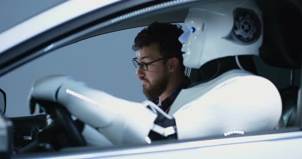 Engineer Testing Car Driving Robot