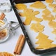 Gingerbread cookies on baking sheet, metal cutter, Christmas spices and decoration, dolly shot - VideoHive Item for Sale