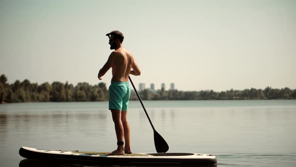 Stand Up Paddle Boarding Fitness. Warm Summer Beach Vacation Holiday. Travel Paddles Paddleboard.