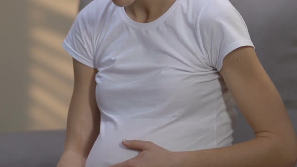 Depressed Hopeless Pregnant Human Trafficking Victim Stroking Belly, Social Ad