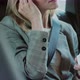 Businesswoman Inserted Wireless Headphones Into Her Ears in Backseat Car - VideoHive Item for Sale