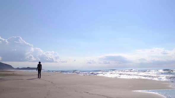 Backpacker Female Walking on Patara Sand Dunes Beach