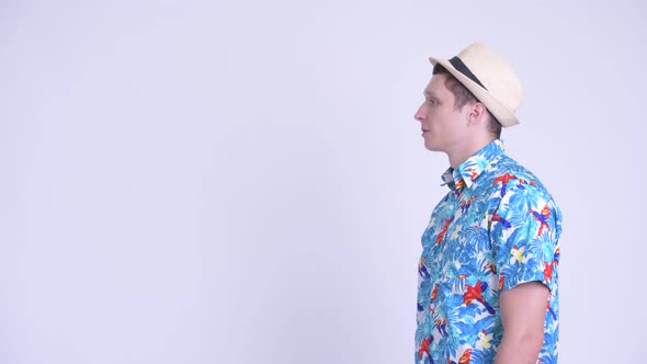 Profile View of Happy Young Tourist Man Smiling