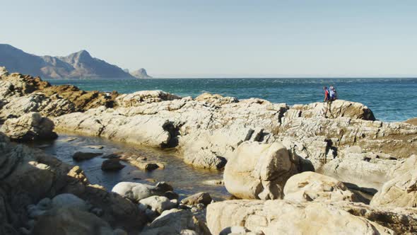 Sporty mixed race man with prosthetic leg hiking