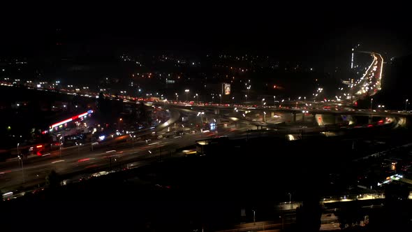 Aerial View of Highway Interchange at Night Timelapse