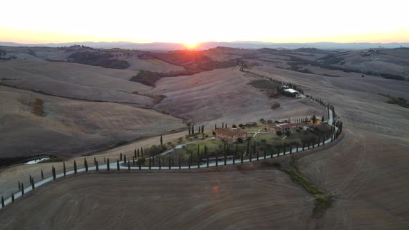 Crete Senesi Tuscan Rolling Hills, Farmhouse and Cypress Road Aerial View in Tuscany