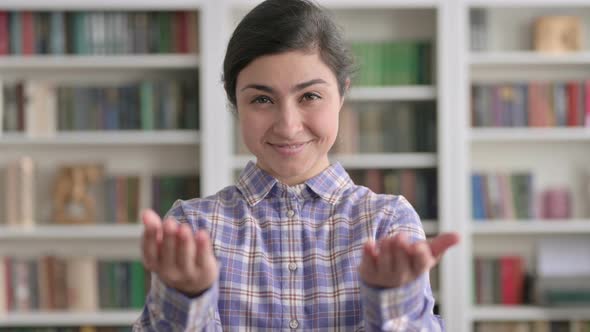 Portrait of Indian Woman Pointing at the Camera and Inviting