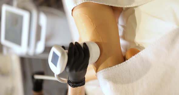 Doctor Doing Ultrasound Liposuction Procedure in Medical Clinic