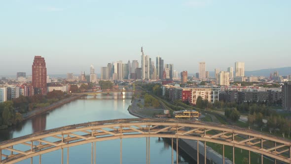 Frankfurt Am Main, Germany Skyscraper Skyline View Slow Dolly Out Revealing Bridge Over Main River