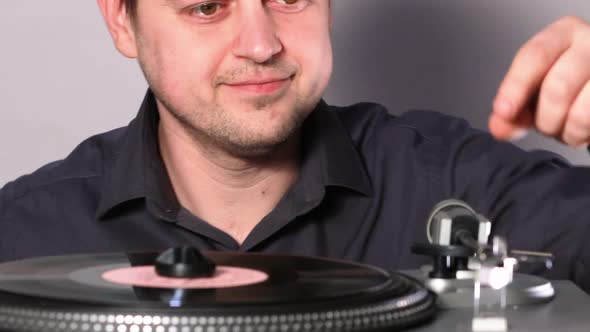 A Young Man and a Vinyl Record Player