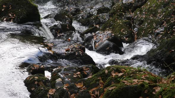 Water Rushing Over Rocks At Swallow Falls In Wales. Locked Off