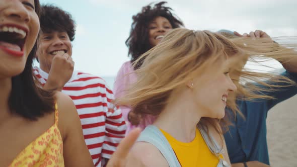 Group of friends having fun on the beach.