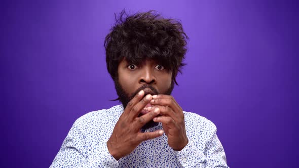 African American Guy with Surprised and Happy Purple Background