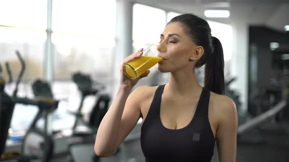 Fit Woman Drinking Refreshing Juice From Glass After Gym Workout, Health Care