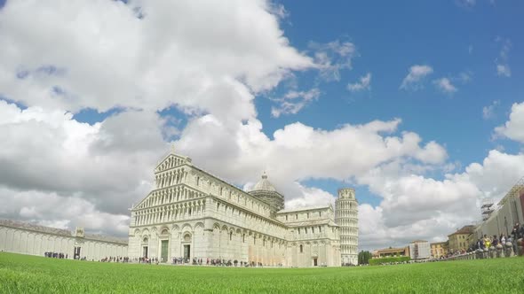 Beautiful White Clouds Flying Above Pisa Cathedral and Leaning Tower in Italy