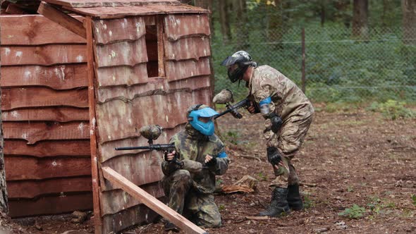 Paintball Team in Uniform and Masks Extreme Sport