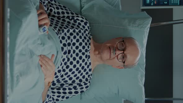 Vertical Video Portrait of Sick Patient Staying in Bed at Hospital Ward