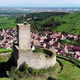 Cinematic aerial shot of old ruined castle overlooking Alsatian village - VideoHive Item for Sale
