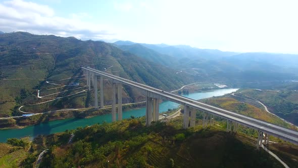 Aerial Photography Style Highway Traffic Bridge River Mountain Real Shot