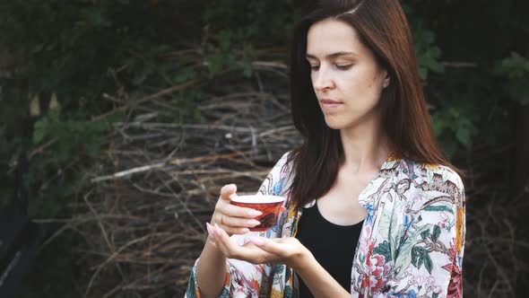 Beautiful Woman have and Relax Evening and tasting Traditional Chinese tea 