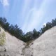 clouds fly over the slopes of chalk quarries with trees on top, time laps - VideoHive Item for Sale