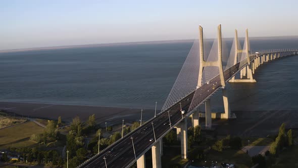 Vasco de gama bridge in Lisbon in Portugal, aerial drone cityscape view 4k