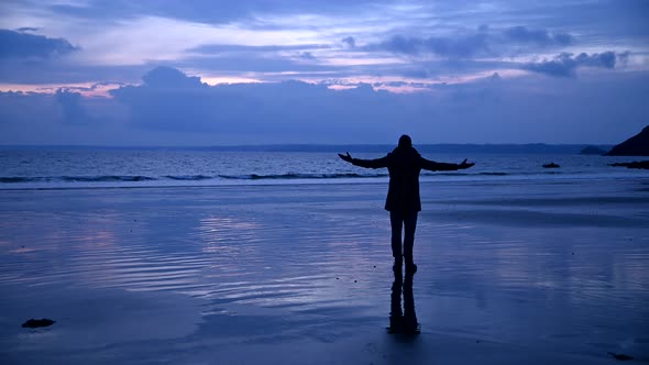 Carefree man enjoying empty beach