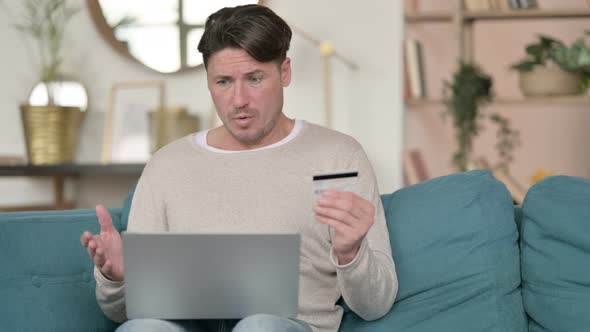Online Shopping Failure on Laptop By Middle Aged Man at Home