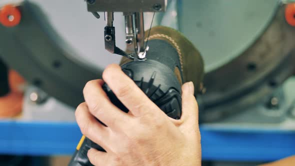 Close Up of a Boot Getting Stitched Mechanically