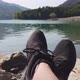 Man Enjoy Relax at Tranquil Lake Pov Shot of Shoes Panning Background - VideoHive Item for Sale
