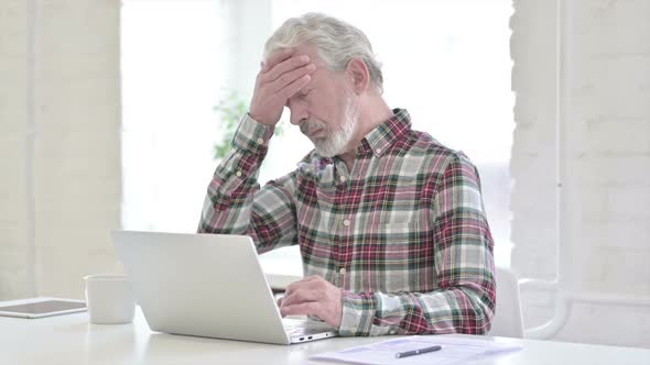 Tired Casual Old Man Having Headache in Office