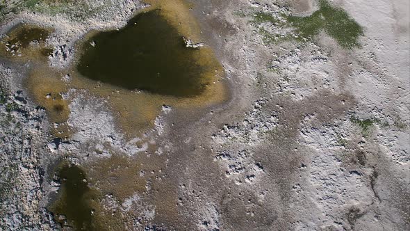 Flying over lake bank with low water