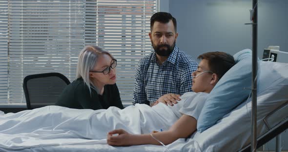 Teenager Boy Lying in Hospital