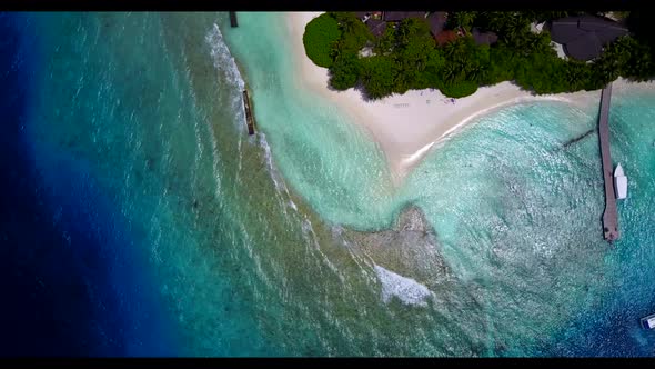 Aerial flying over abstract of beautiful coast beach adventure by blue green water and white sandy b