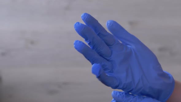 Doctor Nurse Demonstrates Hands in Latex Nitrile Blue Gloves