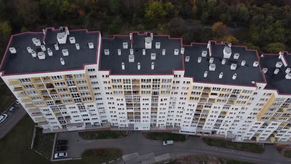 Aerial view of a drone flying over the residential buildings, roof shooting and architecture.