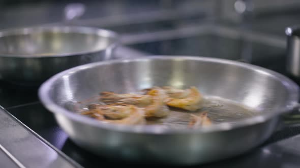 High Angle View Cooking Pan with Shrimps Frying Inside Shaking in Slow Motion