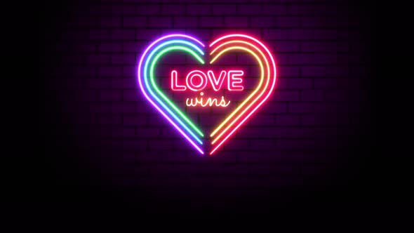 Love Wins Rainbow Heart LGBT Neon Sign Over Wall Background