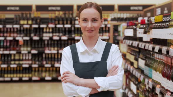 Lady Store Manager Advertises Alcohol Department Closeup