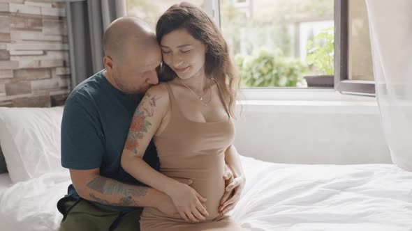 Couple Expecting Baby and Petting Belly