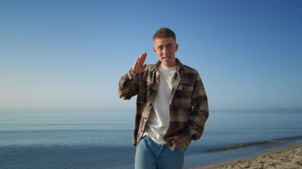 Happy Man Approaching Camera Vlogging on Beautiful Sea Shore Sunny Morning