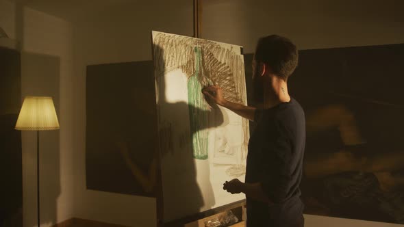 Man Drawing in An Art Studio