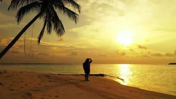 Woman sunbathing on perfect resort beach wildlife by blue sea and white sand background of the Maldi