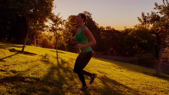 Athletic Woman Running Up A Hill Slow-Motion