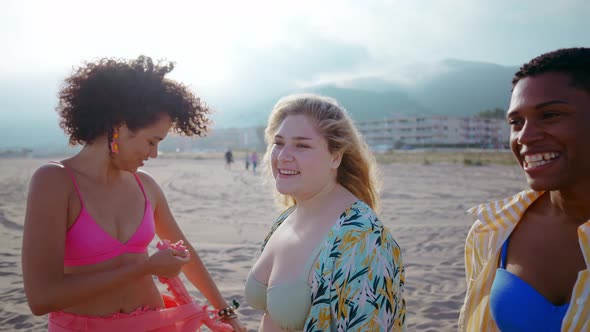 young women having fun on the beach