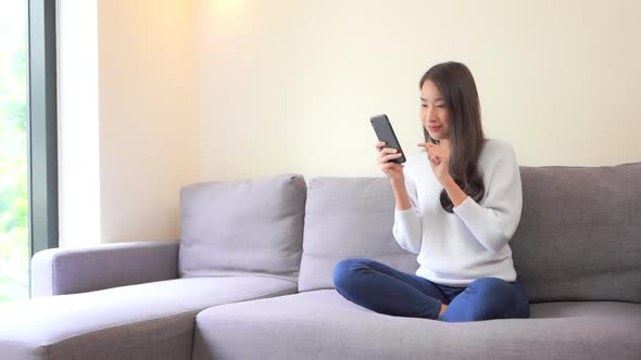 Young asian woman use smart phone