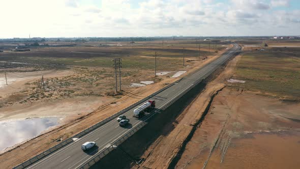 Tank Trucks are Driving Along a Suburban Highway