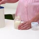 Close up of mother preparing baby formula - VideoHive Item for Sale