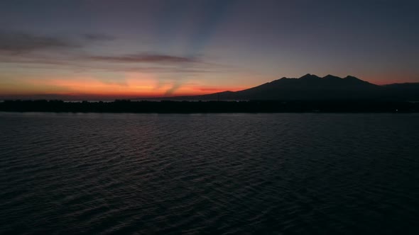 Aerial view of amazing sunset behind a mountain, Gili Trawangan, Indonesia.