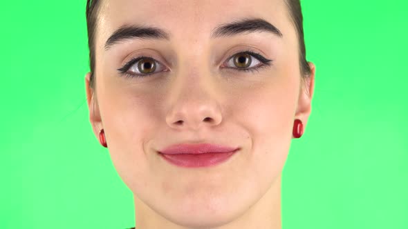 Young Woman Smiling Revealing Teeth. Close Up